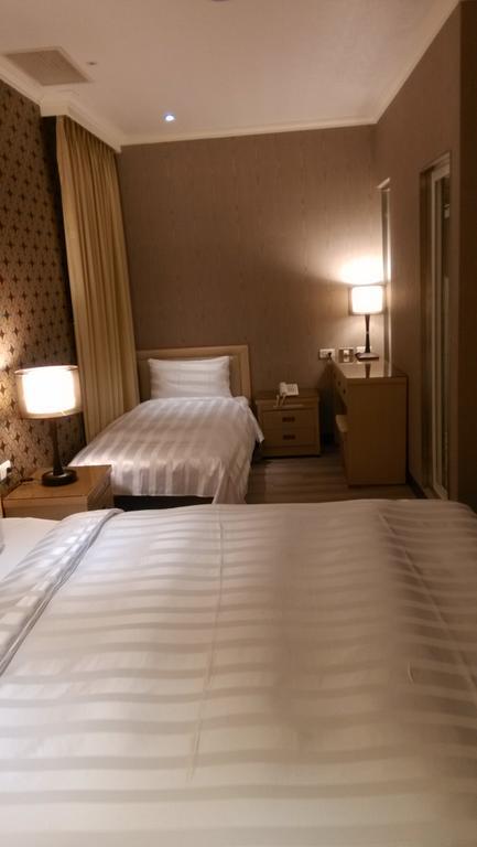 A Casa Hotel Таоуан Стая снимка
