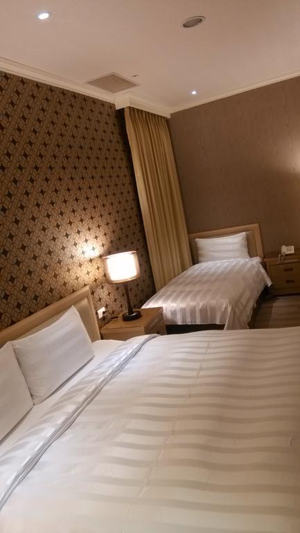 A Casa Hotel Таоуан Стая снимка